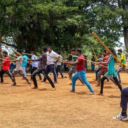 Young girls and boys train in Silambattam, a traditional Tamil martial art, at the Madukkulam Sri Muthumariamman Temple, in Jaffna, Sri Lanka. The training was arranged by ÒPasumaikkana Puratchi Iyakkam,Ó an organization that aims to restore this traditional martial art.    (Thayalini Indrakularasa, GPJ Sri Lanka)